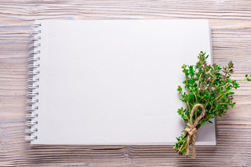 Empty notebook for your text, on wood background