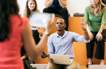 Workspace: Man Has Question During Presentation