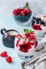 Traditional summer dessert Eton Mess. Broken meringue with whipped cream, berry jam, fresh...