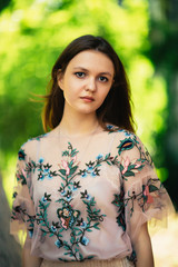 Beautiful young girl on a nature background