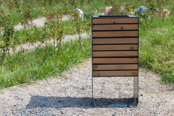Wood trash bin in the park, save nature concept related