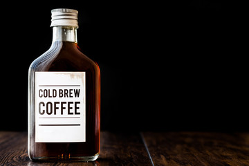 Cold brew coffee in a bottle. - obrazy, fototapety, plakaty