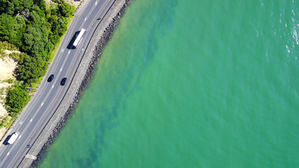 Aerial view on a road running along sea shore. Auckland, New Zealand.