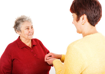 Elderly woman and young caregiver