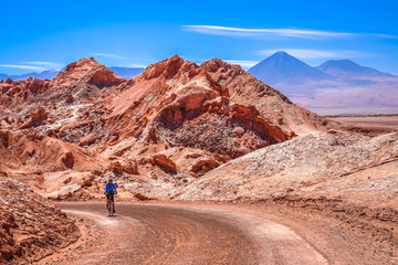 Fototapeta na wymiar Cycling through the famous Valle the la Luna in Chile