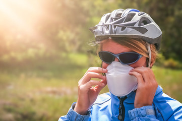 Cyclist wearing a protective mask