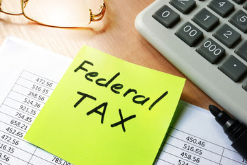 Stick with words federal tax and financial documents. - obrazy, fototapety, plakaty