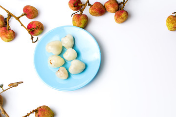 Lychee tropical fruit on a blue plate