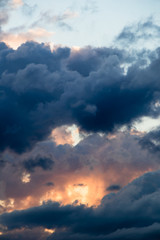 Fototapeta premium magical sky with smoky stratocumulus clouds at sunset - eyes from the clouds