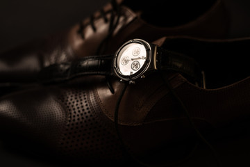 Man's style. Male shoes and watch