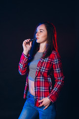  Woman smoking electronic cigarette with smoke