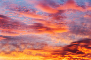 colorful sky at sunset with altocumulus, altostratus and cirrus clouds
