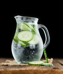 Fresh made Cucumber Water on a rustic background