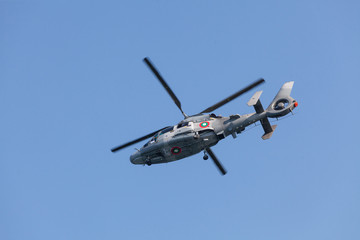 Naklejka na ściany i meble Military helicopter in flight
