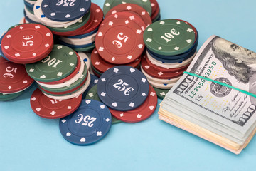 dollar and poker chips on blue background