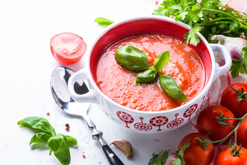 Tomato soup  on white. Vegetarian food.