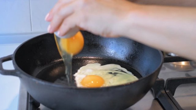 Cinemagraph - Cooking eggs on fry pan.  Motion Photo. 