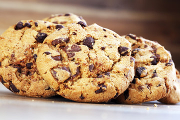 Chocolate cookies on wooden table. Chocolate chip cookies shot