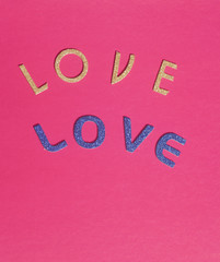 Fototapeta na wymiar Shiny golden end blue letters forming the word love