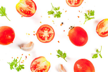Food preparation background. Isolate. Spices and ingredients for cooking. Fresh tomatoes, whole and sliced, parsley, seasoning, spices, salt, garlic. Pattern top view copy space