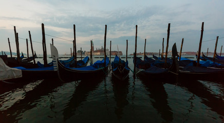 Gondolas moored on the Grand Canal, Venice, Italy