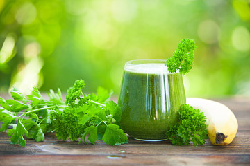 parsley and celery juice in glass on  table