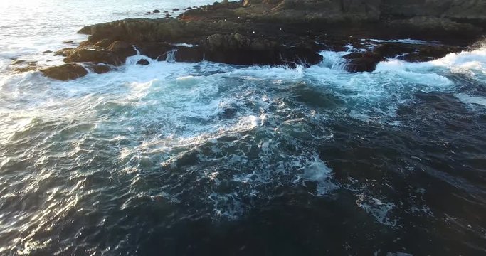 Rotating Shot of Waves Breaking on Rocky Point -
 Footage of Cape Neddick Lighthouse Shore, Maine, USA
