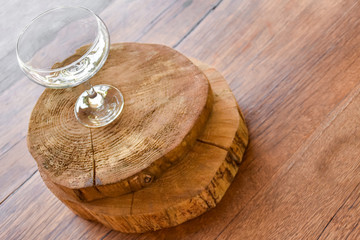 Empty wine glasses on a wooden table or surface