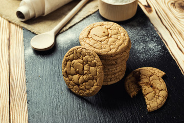 Biscuit sweet cookie background. Domestic stacked butter biscuit pattern concept,close up macro.Homemade cookies on wooden table.Cereal biscuits with the sesame,peanuts,sunflower and amaranth.