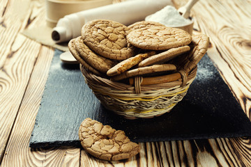 Biscuit sweet cookie background. Domestic stacked butter biscuit pattern concept,close up macro.Homemade cookies on wooden table.Cereal biscuits with the sesame,peanuts,sunflower and amaranth.