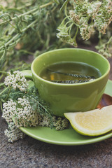 Yarrow tea in a green cup © pawle
