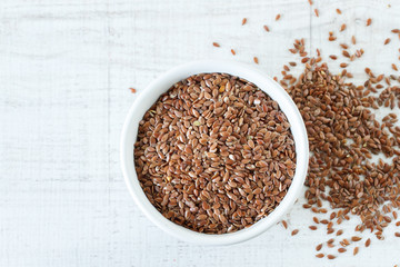 Superfood: flax seeds in a white bowl. Top view