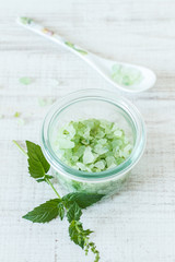 Close-up of mint herb and glass bowl with salt crystals