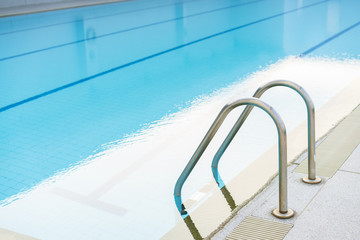 Indoor swimming pool with stair in a building