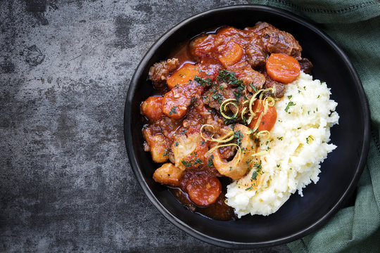 Osso Bucco Beef Stew with Potato Mash Top View on Slate