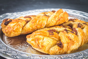 Danish pastry maple pecan with nuts and maple syrup