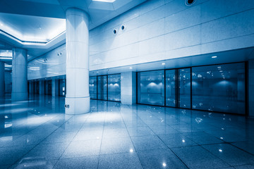 Obraz premium modern building hallway with marbled floor,blue toned,china.