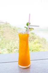 A glass of orange Juice on a table