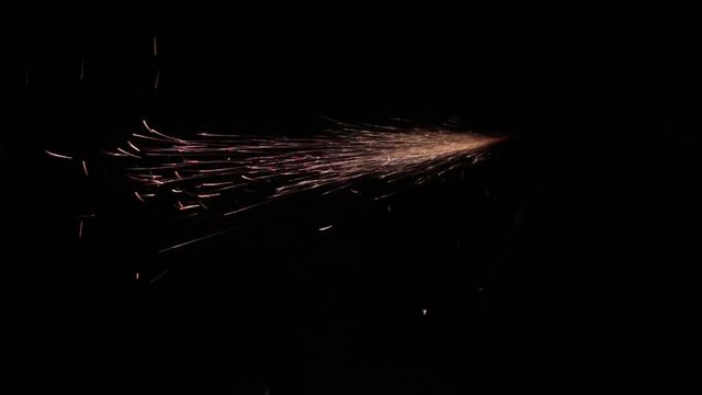 Sparks fly out of the darkness. Screensaver or element for special effects. Black color instead of green background.