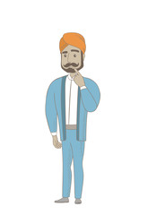 Hindu businessman thinking with finger on chin.