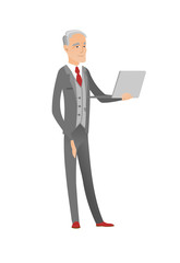 Senior caucasian businessman using a laptop.