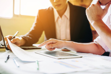 Two businessman investment consultant analyzing company financial report balance sheet statement working with documents graphs. Concept picture for stock market, office, tax,and project.