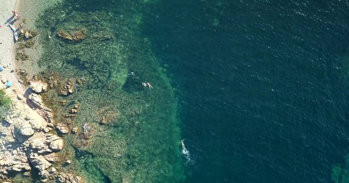 Video from above, aerial view of an amazing beach and turquoise sea in Sardinia, Italy