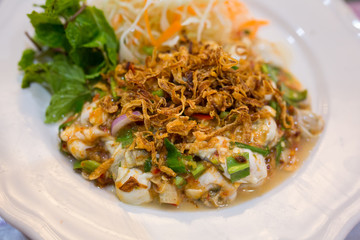  Spicy Oyster Salad  on white plate ( thai seafood menu)