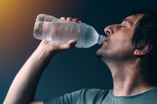Man Drinking Water From The Bottle
