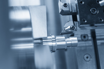 CNC lathe machine (Turning machine) cutting the metal  screw thread part .Hi-precision CNC machining concept.