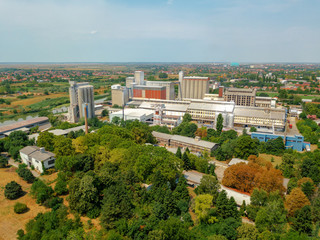Obraz premium Aerial view of industrial cityscape with factory buildings, dron