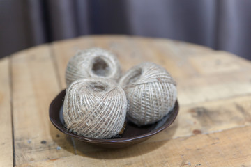 Fototapeta na wymiar Knitting yarn on plate