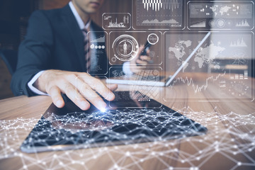businessman using tablet PC and information communication technology concept. Internet of Things. graphical user interface.
