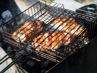 Crusty crust fried chicken roll on barbecue grille